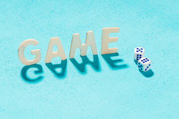 gaming dice and the word game made up of wooden letters