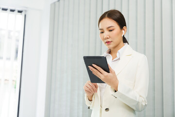 Confidence woman concept, Businesswoman using tablet to checking business plan and financial report