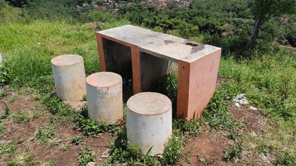 Artificial table and chairs made of cement in the hill area Cikancung, Indonesia