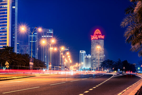 Iconic Ooredoo Tower in West bay Doha City at night with numeros lights