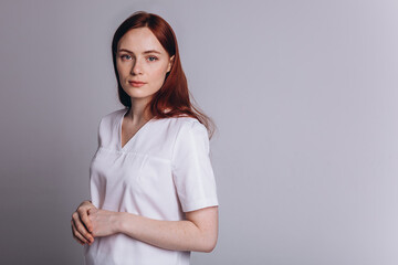 Obraz premium Beauty woman doctor in medical uniform on isolated background. Protection, epidemic, medicine, health care lifestyle concept