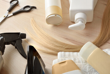 Professional hair care products on wooden table elevated view