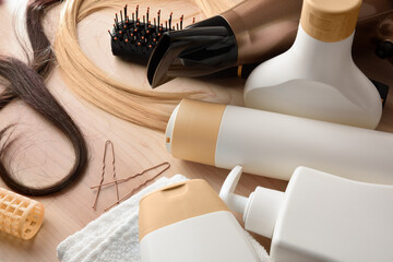 Detail of professional hair care products on wooden table elevated