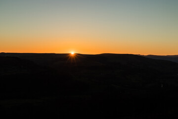 Sunset on the edge of a hillside