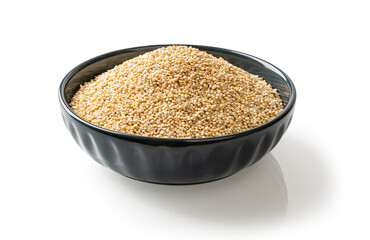 White quinoa grains in a blue ceramic bowl cutout. Dry chenopodium quinoa seeds on a plate isolated on a white background. Concept of gluten free superfood for vegetarian healthy eating.