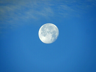 full moon in the sky with clouds