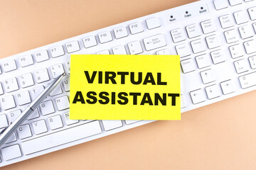 Text VIRTUAL ASSISTANT text on a sticky on keyboard, business concept