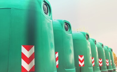 Shot of brand new trash bins in a row, ready to be place in the city. Concept of recycling waste.