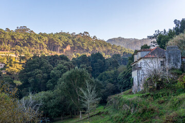 Fototapeta na wymiar Sintra Mountain valley covered with green forest at the Sintra-Cascais Natural Park, hiking trail in Portugal