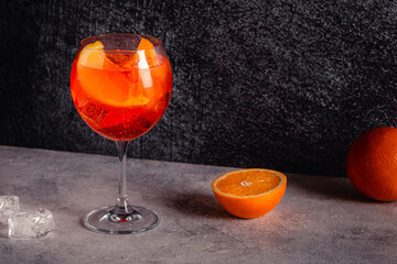 Glass of cold Aperol spritz cocktail.