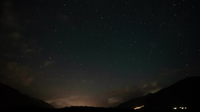 Timelapse of dramatic storm with lightnings over alpine pass in dark summer evening. High quality 4k footage. Resia Pass, Alto Adige, Italy