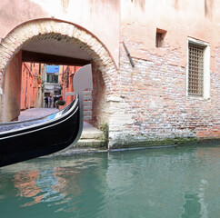 Fototapeta na wymiar bow of the typical venetian boat called GONDOLA in Venice