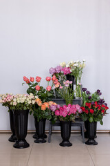 Flower shop. Lots of flowers in vases. Roses, ranunculus, tulip, alstroemeria