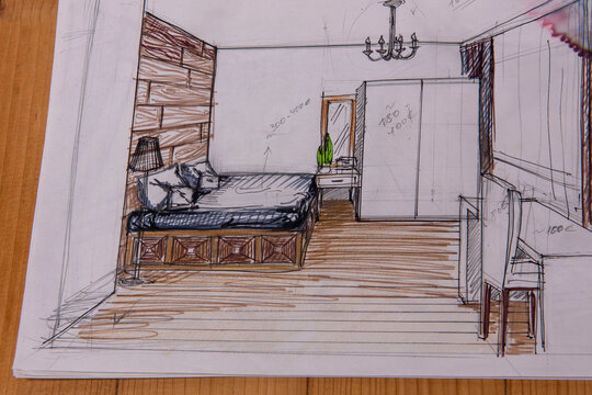 The photo shows sketches, a design project drawn with pencils on a piece of paper. Drawings, sketches, pencils, stationery on the table.
