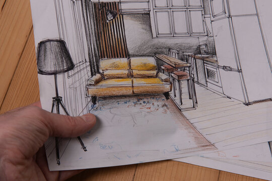 The photo shows sketches, a design project drawn with pencils on a piece of paper. Drawings, sketches, pencils, stationery on the table.