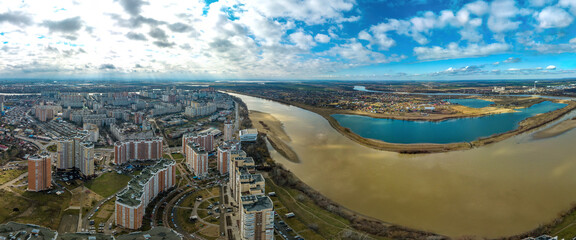 aerial panorama of the city of Krasnodar near the Kuban River and the blue lake Starozhegokai in the Republic of Adygea - obrazy, fototapety, plakaty