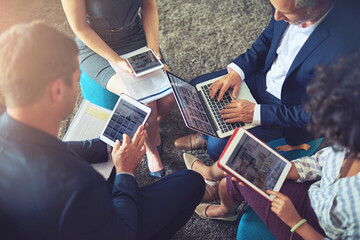 Technology has changed the geography of the office completely. High angle shot of a group of...