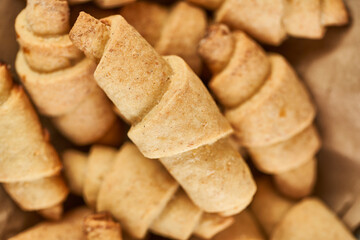 Russian slavic traditional pastry called roguelikes. Cakes bagels. Crispy croissants. Food on grey background, Closeup view
