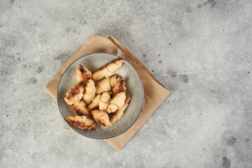 Russian slavic traditional pastry called roguelikes. Cakes bagels. Crispy croissants. Food on grey background, Copy space