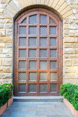 Fototapeta na wymiar Antique door in historical building - Concept of security, mystery, grunge.