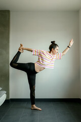 Beautiful woman practicing home yoga. Lifestyle concept