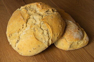 loaf of sourdough bread, home made freshly baked natural ingredients, freshness, trendy, close-up.