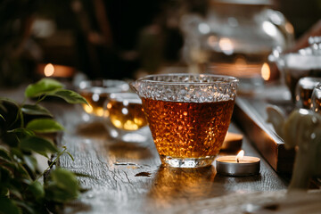 Beautiful chinese tea in teacup with candle flame decoration