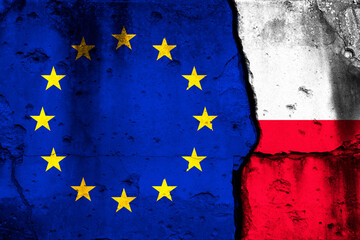 Europe Union and Poland crisis. Background with national flags on cracked wall photo