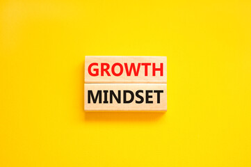 Growth mindset symbol. Wooden blocks with concept words Growth mindset on beautiful yellow background. Business growth mindset concept. Copy space.