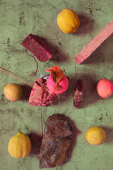 Still Life yellow and green lemons composition in a stone background