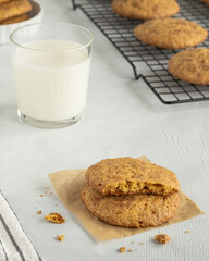 Pumpkin cookies, glass of with milk, cookies on the cooling rack