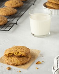 Pumpkin cookies, glass of with milk, cookies on the cooling rack