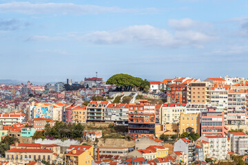 Fototapeta na wymiar The view from miradouro, observation viewpoint of Lisbon, old architecture with red roofs in Lisbon, Portugal