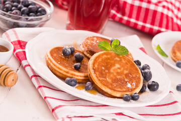 Pancakes with blueberries and chocolate cream.