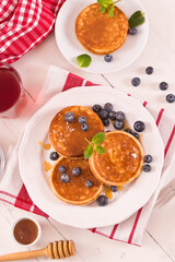 Pancakes with blueberries and chocolate cream.