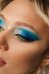 Fototapeta premium Beautiful blonde with blue-yellow make-up. Ukrainian girl with makeup
