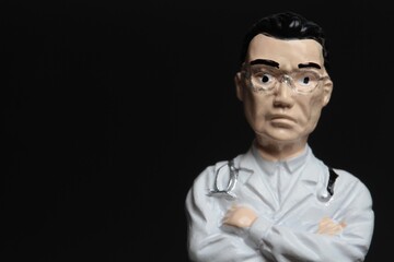 closeup portrait of a miniature figurine of a doctor