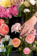Floris chooses flowers. Flowers in hands. Ranunculus