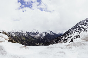 Snow with mountains in the background