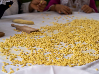 Homemade Sardinian gnocchi (Malloreddus), a type of traditional Sardinian pasta, made only with water, durum wheat semolina and salt. Traditional Italian food