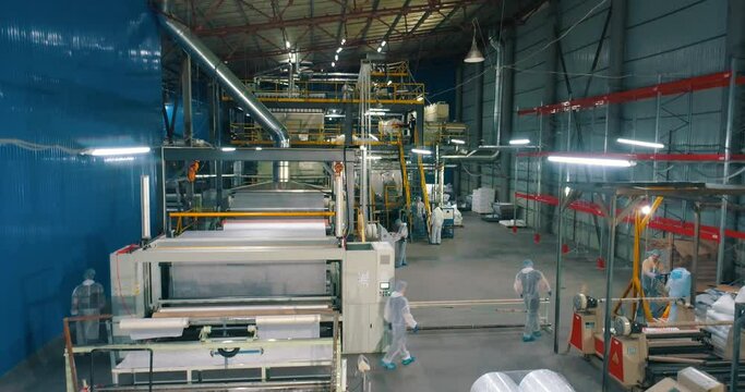 Workshop of the non-woven fabrics factory. Production of nonwoven materials. Modern shop of nonwoven materials. industrial interior