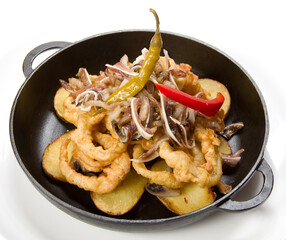 Onion rings fried in batter with potato and meat.