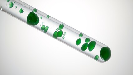 Green oil being poured in test tube with transparent liquid creating green bubbles on light grey background | Abstract cosmetics mixing concept