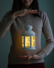 girl holding a lantern. Levitation effect