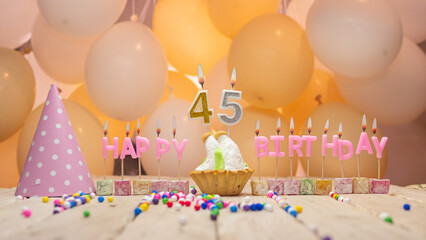 Beautiful background happy birthday number 45 with burning candles, birthday candles pink letters...