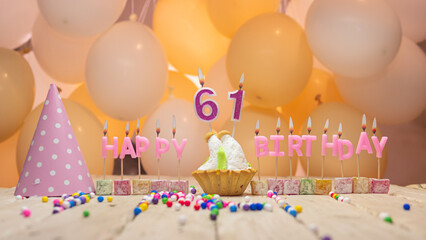 Beautiful background happy birthday number 61 with burning candles, birthday candles pink letters...