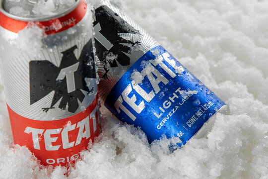 Mexico ,CDMX - April 08, 2022: Tecate Light and Original beer with ice and white background. copy space