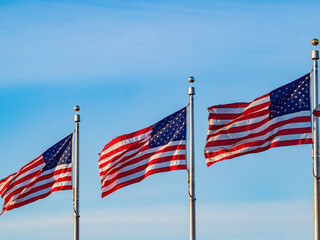 Close up shot of many American flag swinging