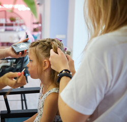 Fototapeta premium Children make up. Glitter makeup. Sparkles on cheek.