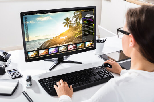 Businesswoman Using Computer At Workplace